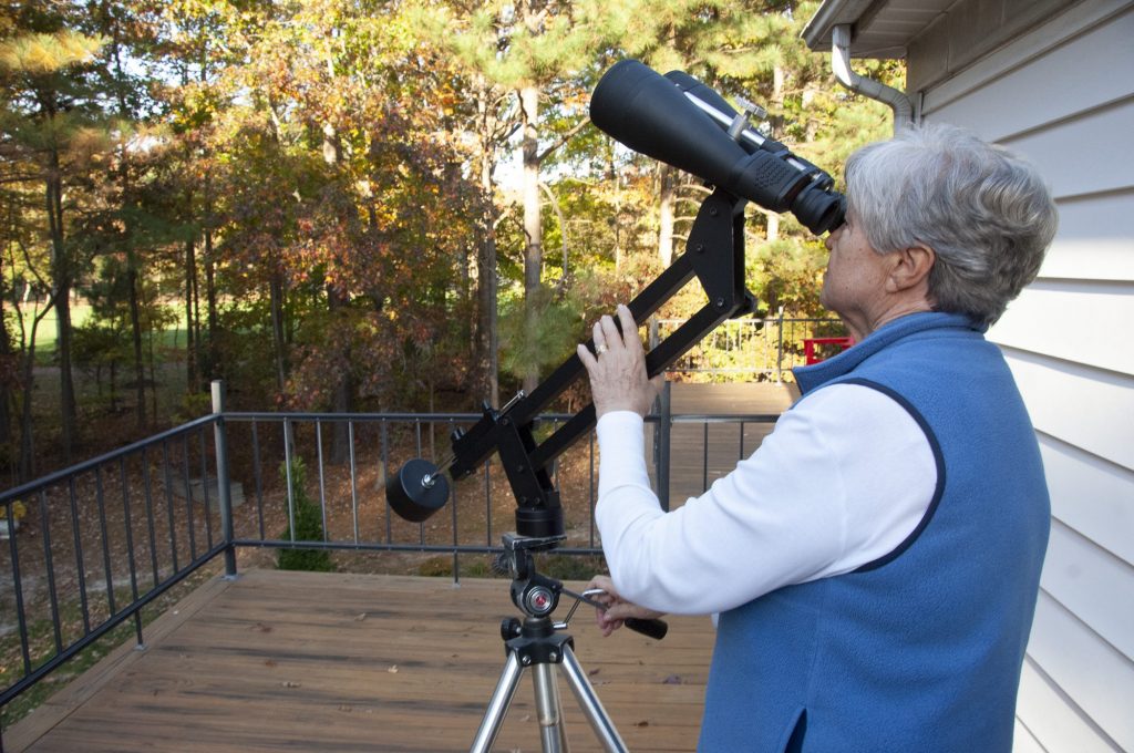 A parallelogram holds high powered binoculars steady 
